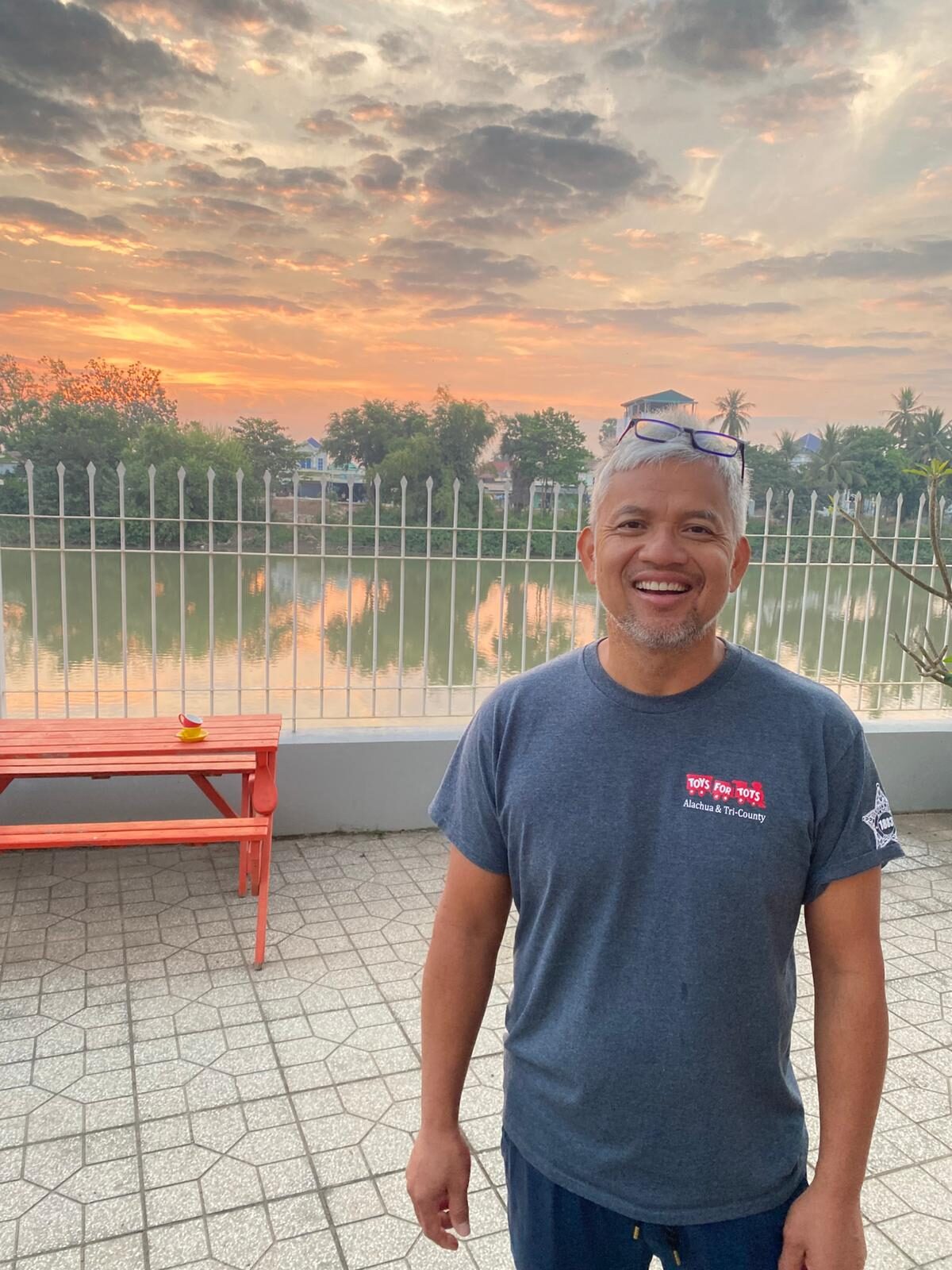 Nareth Meth, co-founder of Light of Cambodia, standing outdoors in Cambodia